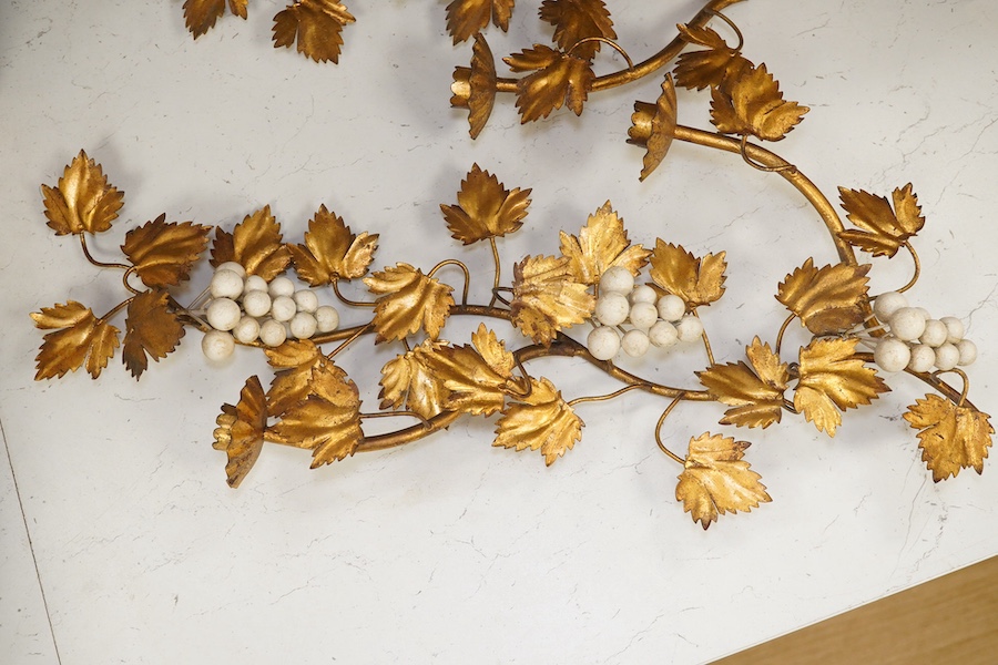 A pair of gilt metal and porcelain ‘white berry’ two branch wall sconces, 55.5cm. Condition - fair to good